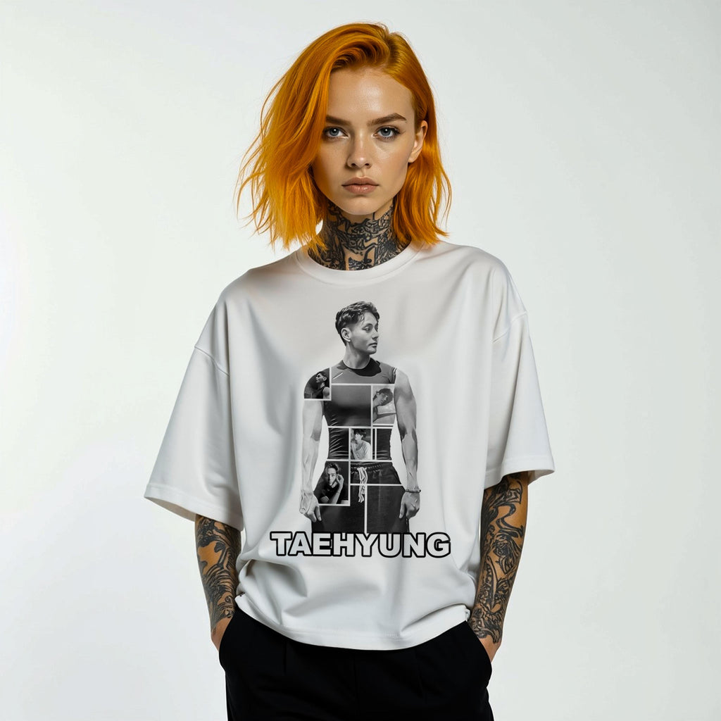 Person wearing a white t-shirt with a graphic design and 'TAEHYUNG' text on a plain background