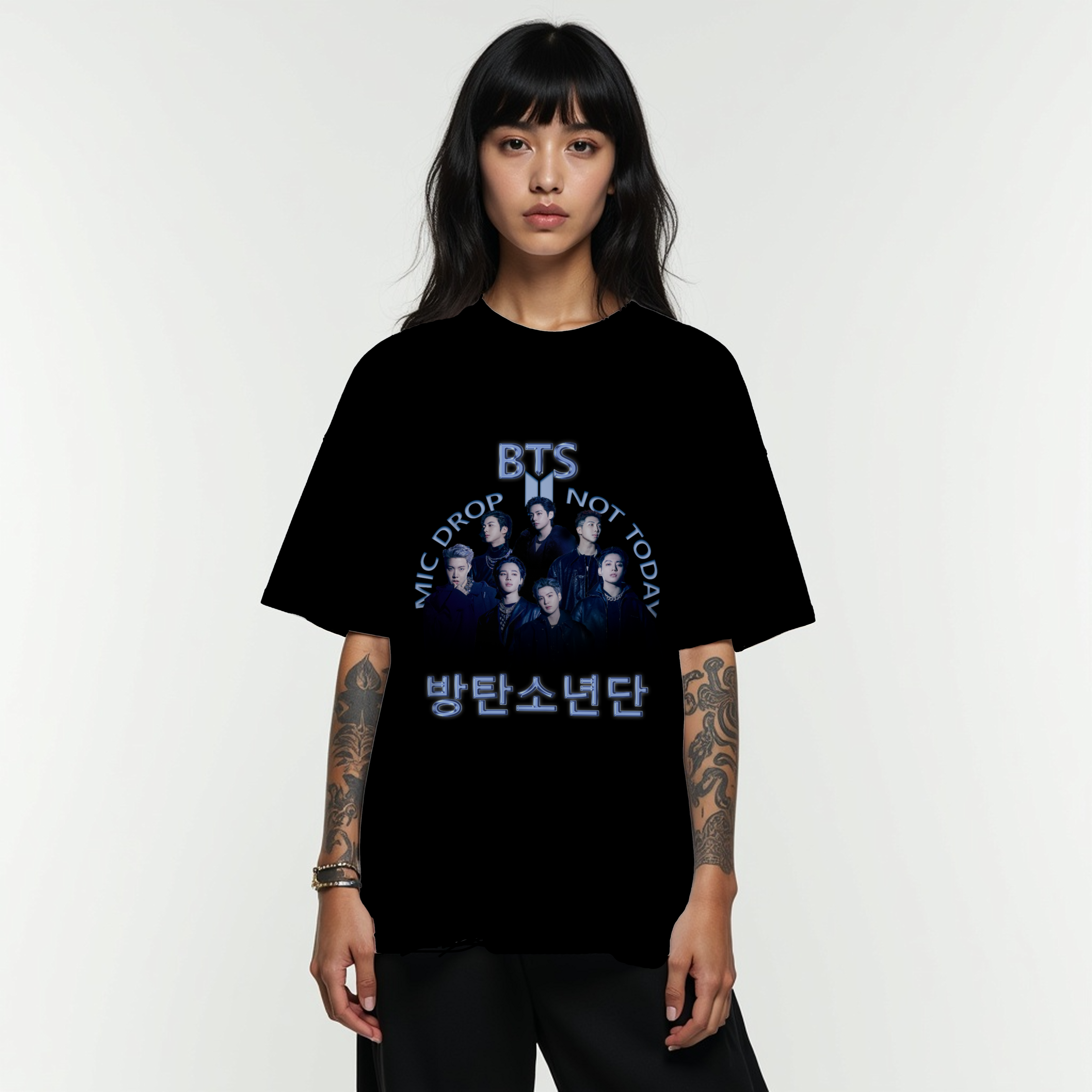 Person wearing a black t-shirt with BTS graphic and text